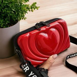 - Mini Luggage Crossbody Handbag size 7 by 3 by 2 inches. BAGGU